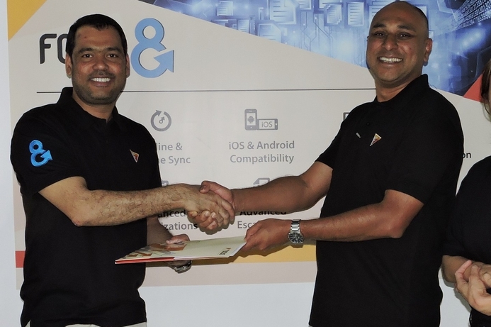 Ali Hyder, group CEO, Focus Softnet (left) shakes hands with Naved Sheikh, CEO of Future Kenya after signing the deal. Focus cements East Africa footprint