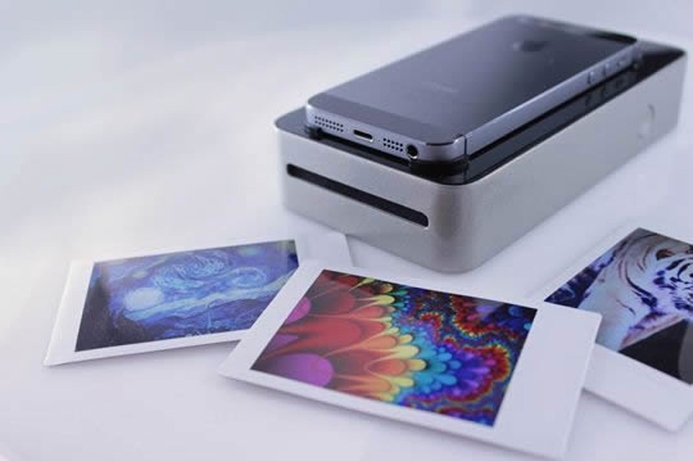 Users place their phone face-down on top of the SnapJet, which scans the image on the screen and prints it out on Polaroid 300 or Fujifilm Instax. New device to print smartphone snaps as Polaroids