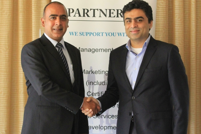 Cerebra founder Asit Ahuja (Left), shakes hands with Inventum CEO Sachin Mehra after signing the deal. Inventum, Cerebra partner for Middle East