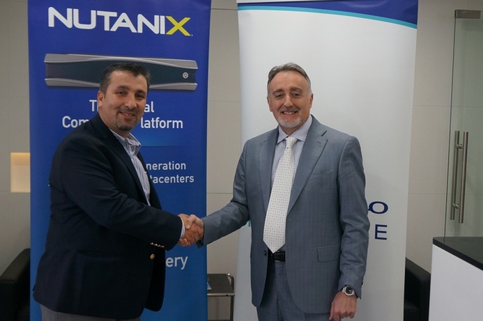 Mindware's Mario Gay (right) shakes hands with Nutanix's Ahmad Qadri after signing the deal. Nutanix signs Mindware for Middle East