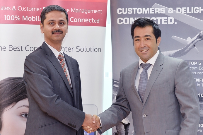 Tech Mahindra's Ram Ramachandran (left), shakes hands with Vocalcom's Ali Kassab after signing the deal. Vocalcom, Tech Mahindra sign reseller alliance