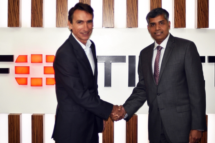 Fortinet's Alain Penel (left), shakes hands with Redington's Ramkumar Balakrishnan after signing the distribution deal. Fortinet appoints Redington Value as MEA VAD