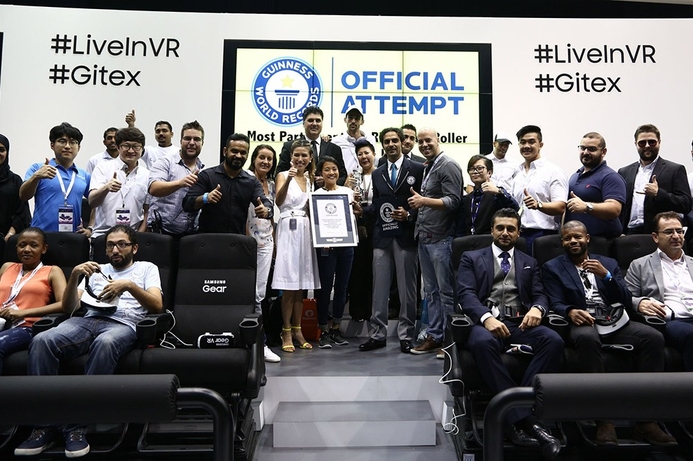 DWTC staff and record-breaking show attendees ready to ride the virtual reality rollercoaster from Samsung. GITEX sets record in VR