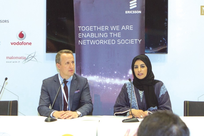 Reem al-Mansoori, Assistant Undersecretary for Digital Society Development, MOTC with Wojciech Bajda, Head of Industry and Society Unit at Ericsson Region Middle East at the signing ceremony at QITCOM. MOTC and Ericsson sign MoU at QITCOM 2017