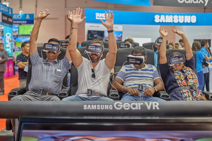 Visitors during this year's GITEX Shopper use Samsung's Gear VR headset. AR and VR headsets continues to gain strong momentum worldwide