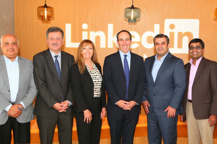 LinkedIn and GBM executives have a picture taken after announcing their partnership. GBM adopts social selling concept with LinkedIn