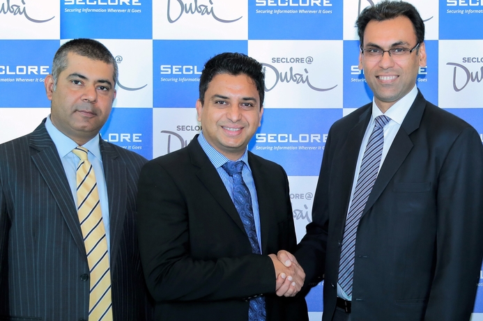 Executives from Seclore Technologies and Redington Gulf FZE shake hands after signing the deal. Seclore appoints Redington Gulf FZE as its distributor