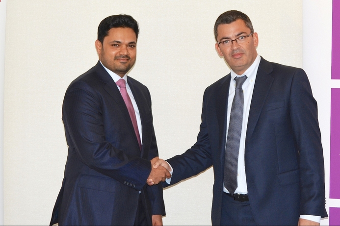 ISYX Technologies CEO Sharoon Shamsuddin (left), shakes hands with Luis Ortega,MD at IFS after signing the deal. ISYX Technologies joins IFS Partner Network