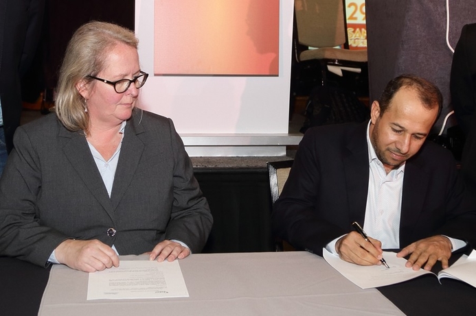 Margrete Raaum, chair of FIRST, and Eng. Bader Alsalhi Director General of OCERT, sign the agreement. OIC signs agreement with FIRST for cybersecurity
