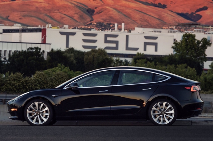 Tesla CEO Elon Musk showcased the $35,000 Model 3. First batch of customers receive the Tesla Model 3