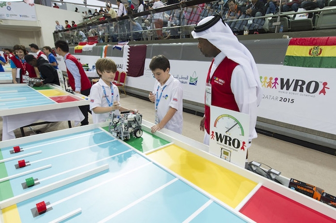 The World Robot Olympiad brings together teams of students for robotics competitions. Juniper Networks partners with World Robot Olympiad