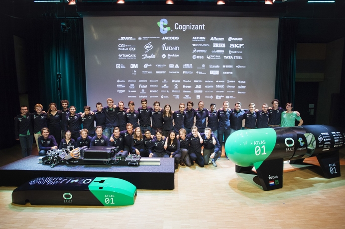 Delft University team with its hyperloop pod model and the launcher sled that it says will enabled high speed propulsion of hyperloop pods. Delft University aims to set hyperloop speed record