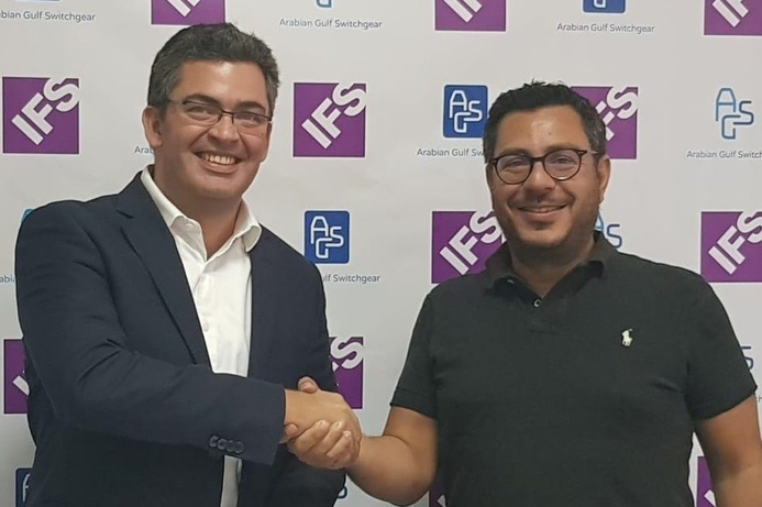 Luis Ortega, Managing Director at IFS for Middle East, Africa and South Asia, signs agreement with AGS managing director George Pandehis. AGS selects IFS to automate business processes
