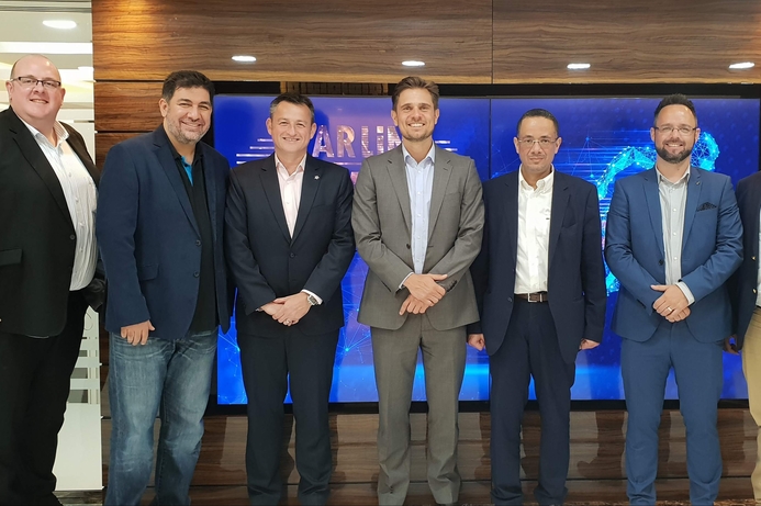 Executives from Blackberry and StarLink at the signing ceremony. StarLink partners with BlackBerry