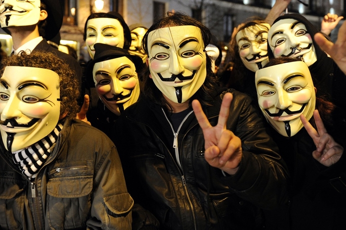 The masks that Anonymous members use to disguise themselves in public, are copyrighted to Time Warner. Anonymous boosts Time Warner profits