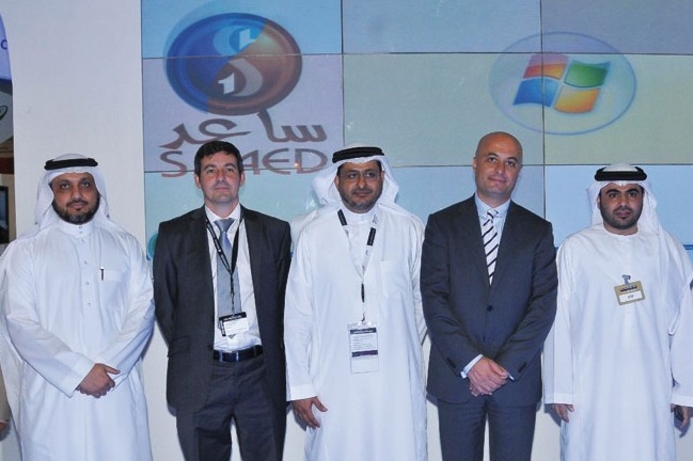 The Saaed and Microsoft teams announce the OS and database deal. Saaed chooses Microsoft systems