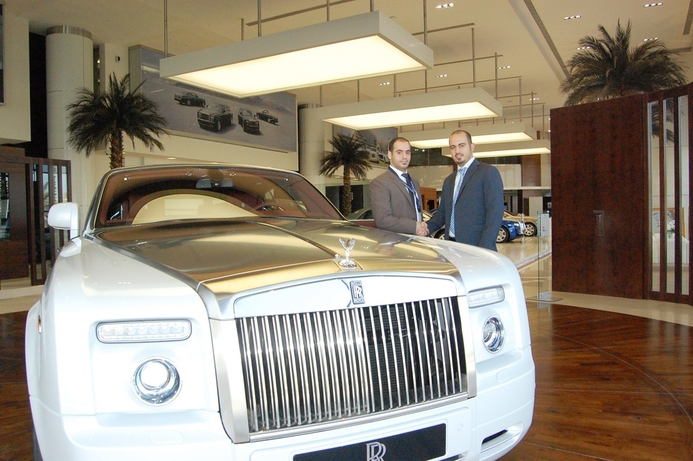 (l) Osama Abu Shaaban, Al Saqer Group and Alaa Darwish, R&M sales manager. Abu Dhabi Motors rolls out R&M network