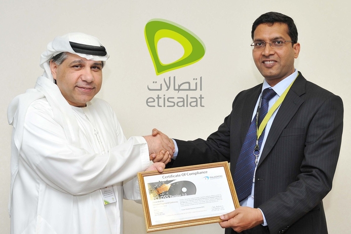 Fadhil Al-Ansari, Executive Vice-President/Engineering Etisalat receiving the certificate from Paladion's CEO Rajat Mohanty. Etisalat acquires PCI-DSS 2.0