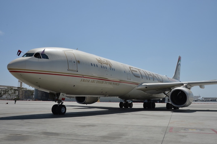 Etihad displays US and UAE flags upon arrival of the inaugural flight from Abu Dhabi International Airport to Los Angeles International Airport last month. 'Charge phones before flying,' say US security officials