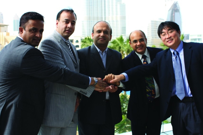 Trigon and Sony executives celebrate their distribution tie-up. Trigon takes on Sony Gulf storage assignment
