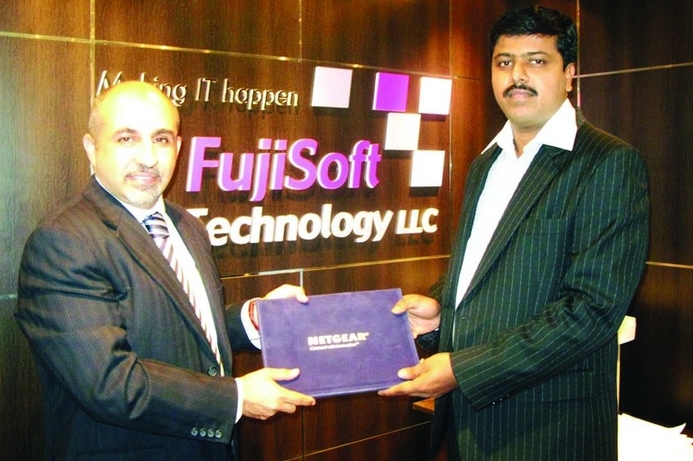 Omar Lutfi Azzawi, SMB channel manager at Netgear (left) welcomes Albert Raj of Fujisoft Technology into the company’s partner network. Netgear signs VAR, launches SMB sales programme