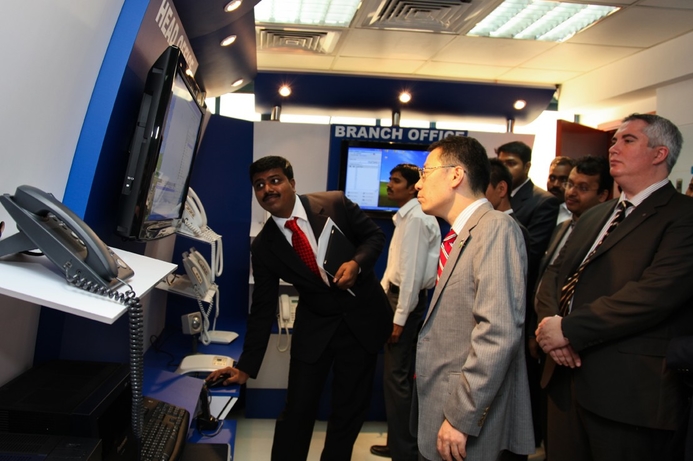 (l) Albert Raj of Fujisoft demonstrates the new centre's capabilities to Yasuhiro Mashiko, director of Panasonic's Communications Systems Business Unit and Shaun Sullivan of Al-Futtaim Panatech. Fujisoft opens Panasonic UC support and training centre