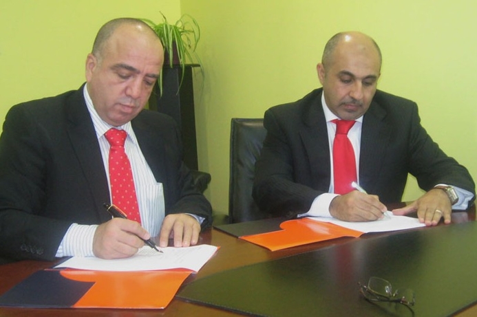 NIT’s Wael Abdallah and Netgear’s Omar Lutfi Azzawi at the signing of a partnership agreement between the two companies. Netgear adds new reseller to channel line-up