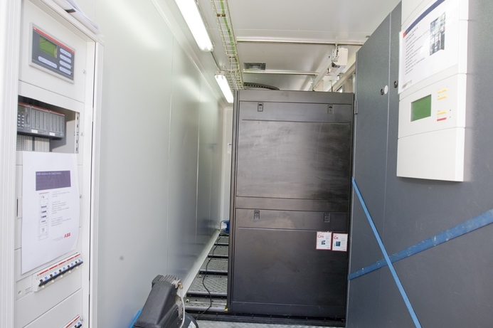 Standard 19 inch racks are mounted in the centre of the container, but are placed on runners so that racks can be moved back and forth for easier access IBM shows off mobile data centre