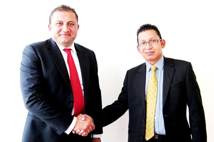 (l) Serjios El-Hage of EMW with Shaheen Haque, Interactive Intelligence. Interactive Intelligence signs EMW