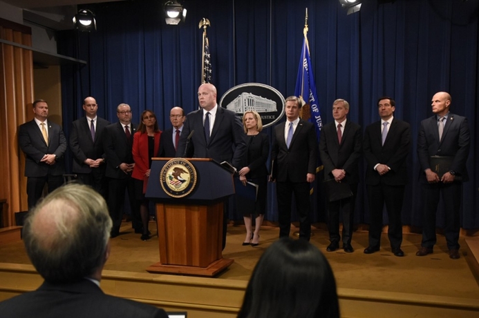 Acting Attorney General Matthew Whitaker announces the indictments against Huawei. US Justice Department files criminal charges against Huawei