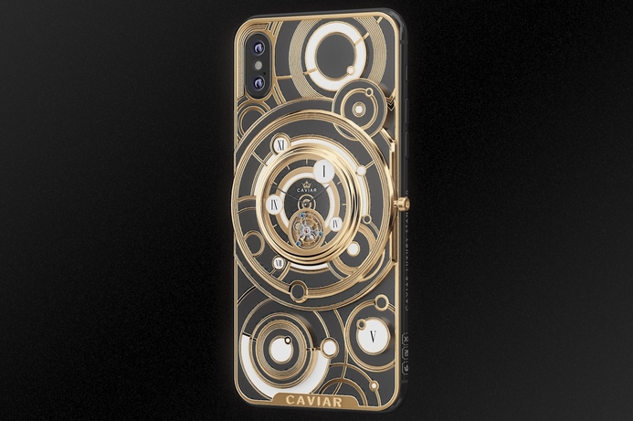 Caviar's new limited edition luxury iPhone features a mechanical watch mechanism mounted on the outside of the phone. Caviar merges iPhone XS and high-end mechanical watch